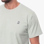 Light gray t-shirt with a small logo on the chest against a white background