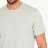 Light green t-shirt with a small logo on a white background