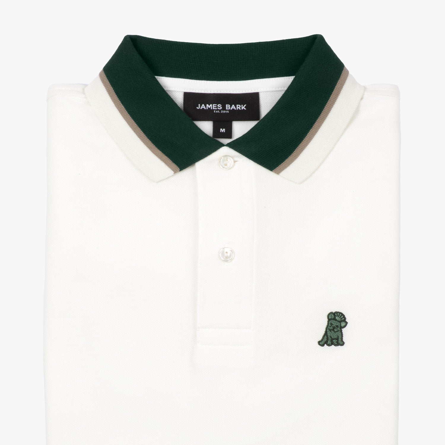 Close-up of the collar and buttons of the white polo shirt: A detailed view of the dark green collar, showing the button placket and the small embroidered dog logo on the chest.