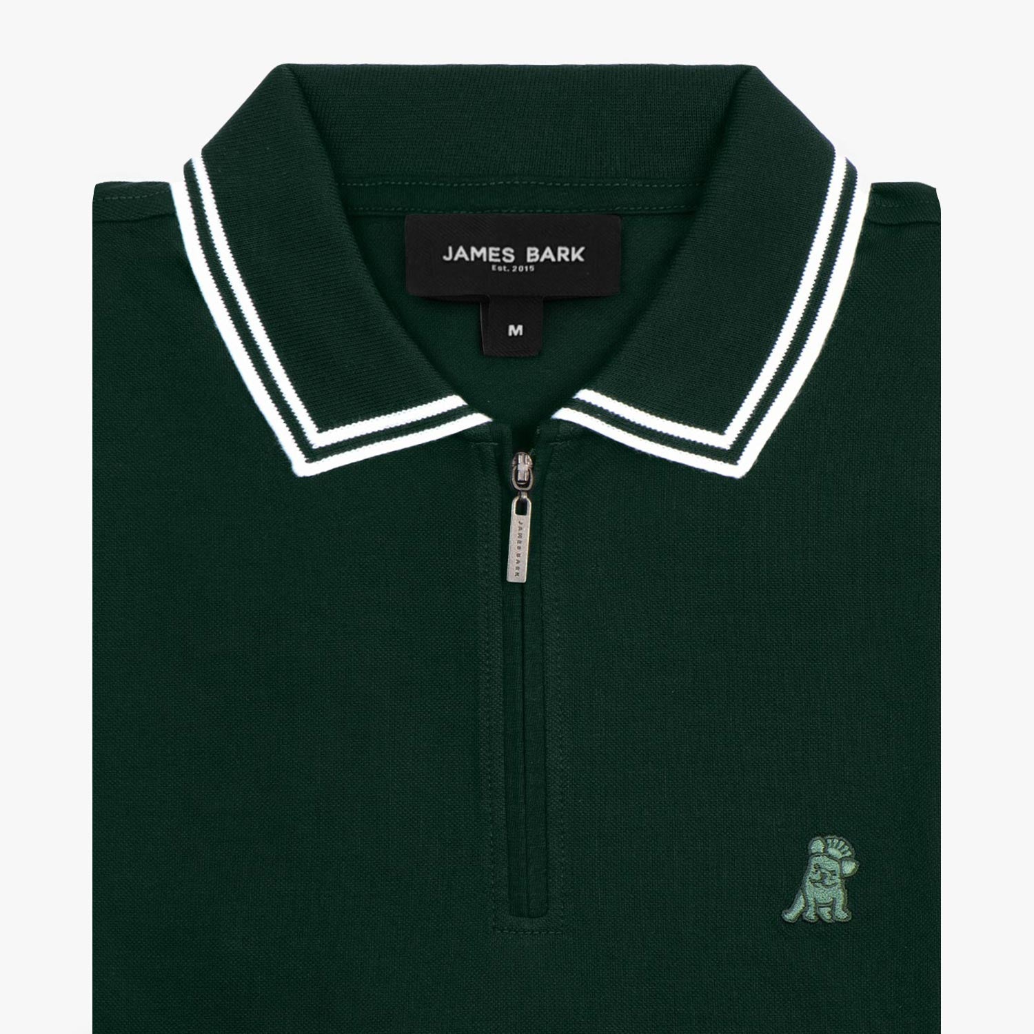 Flat lay of a dark green polo shirt with white trim on the collar and sleeves.