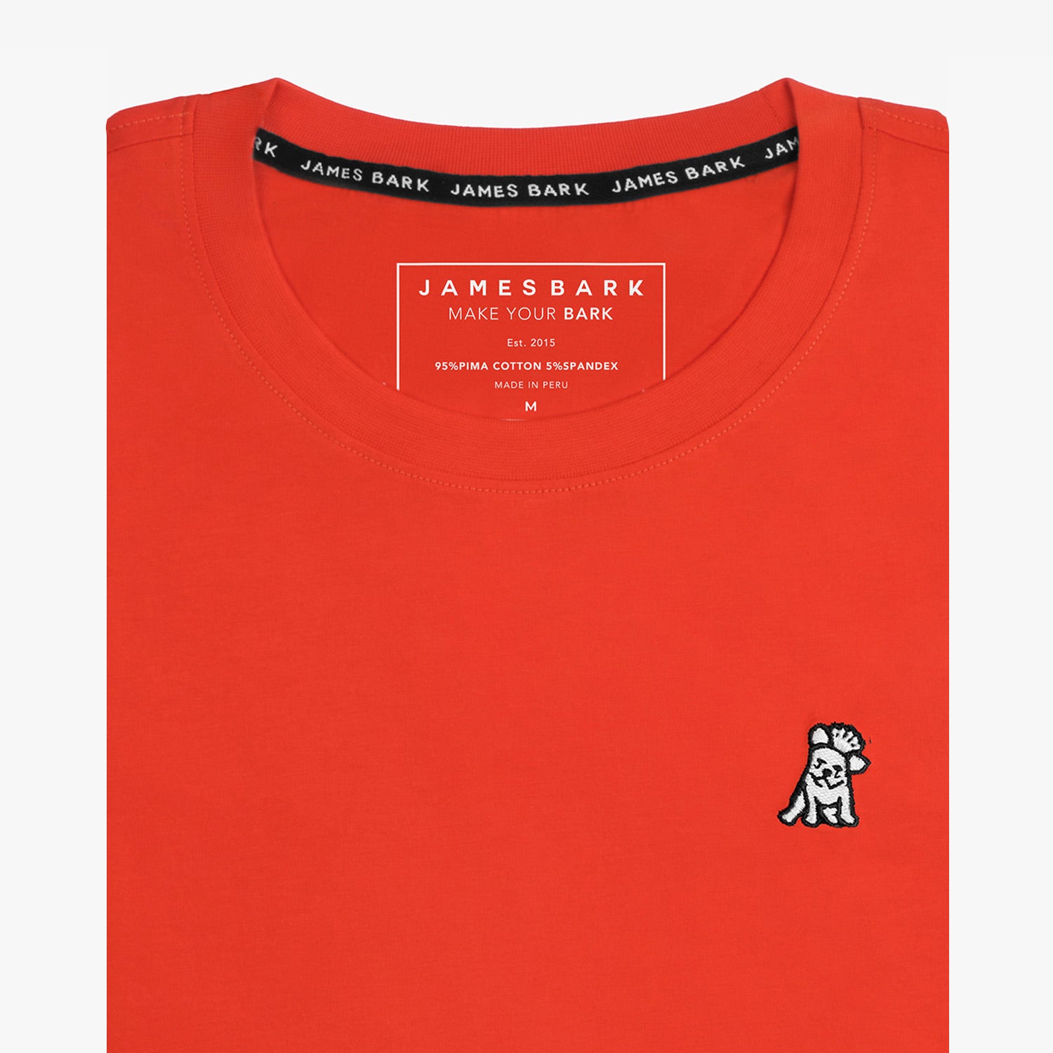 The orange t-shirt laid flat, showing the front of the shirt with the small embroidered animal logo on the left chest.