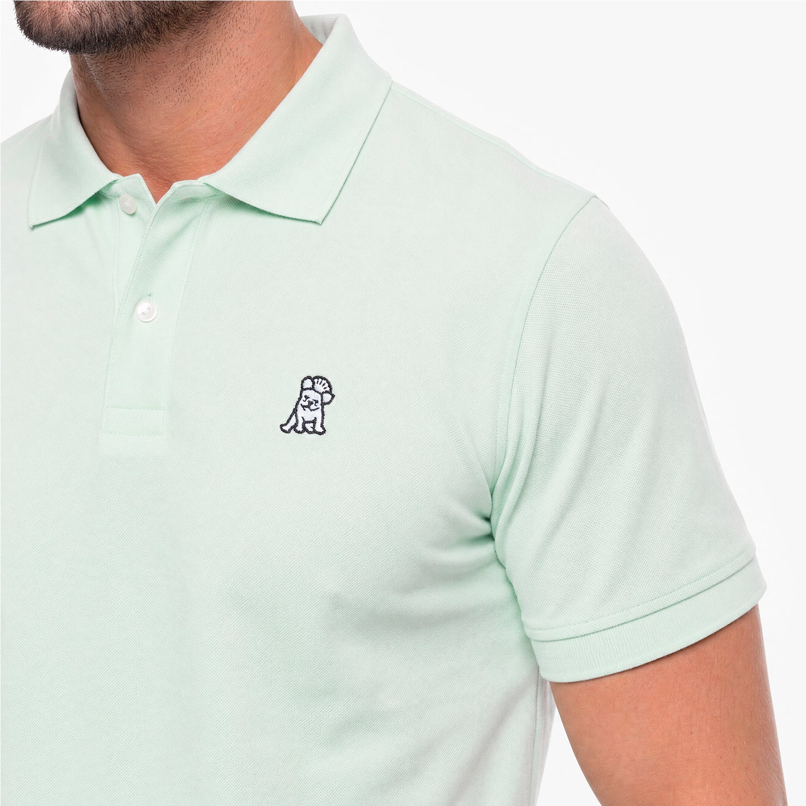 Light green polo shirt with a small logo on a white background