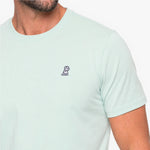 Light green t-shirt with a small logo on a white background