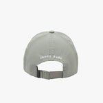 Rear view of the grey cap showing "JAMES BARK" text in white letters