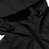 Close-up of the hood area of a black jacket, featuring adjustable black drawstrings with toggle locks on each side. The jacket has a black zipper at the front, with a sleek and functional design. The stitching is clean and the fabric appears durable, emphasizing the jacket’s utility.