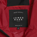 Detail of the adjustable hood drawstring on the red jacket.