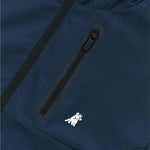 Close-up of a navy blue jacket featuring a black, waterproof zipper on a chest pocket. Below the zipper, there is a small embroidered white dog wearing a crown, adding a playful detail to the design.