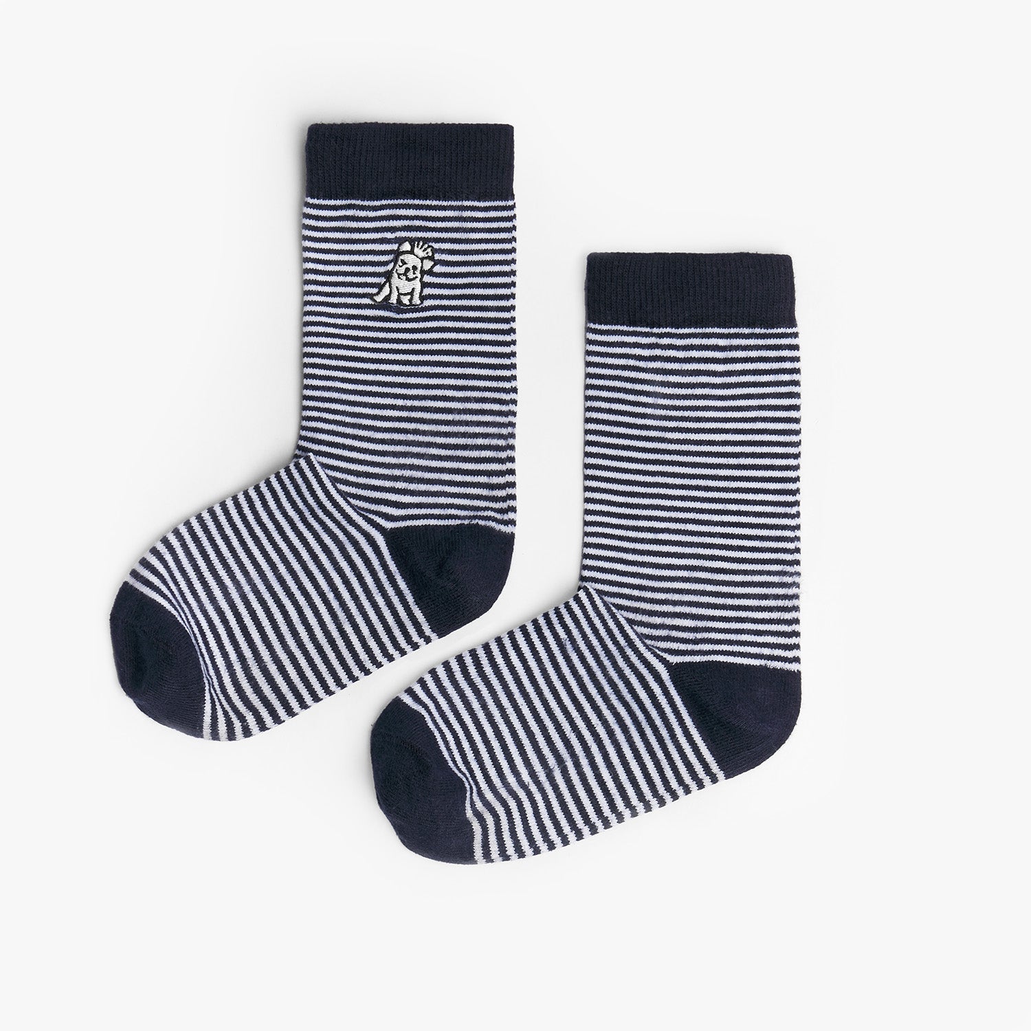 A pair of navy blue and white striped mid-calf socks with a solid navy cuff, heel, and toe. There is a small dog graphic near the ankle and the text 'JAMES BARK' printed near the toe. The socks are laid flat on a white surface.