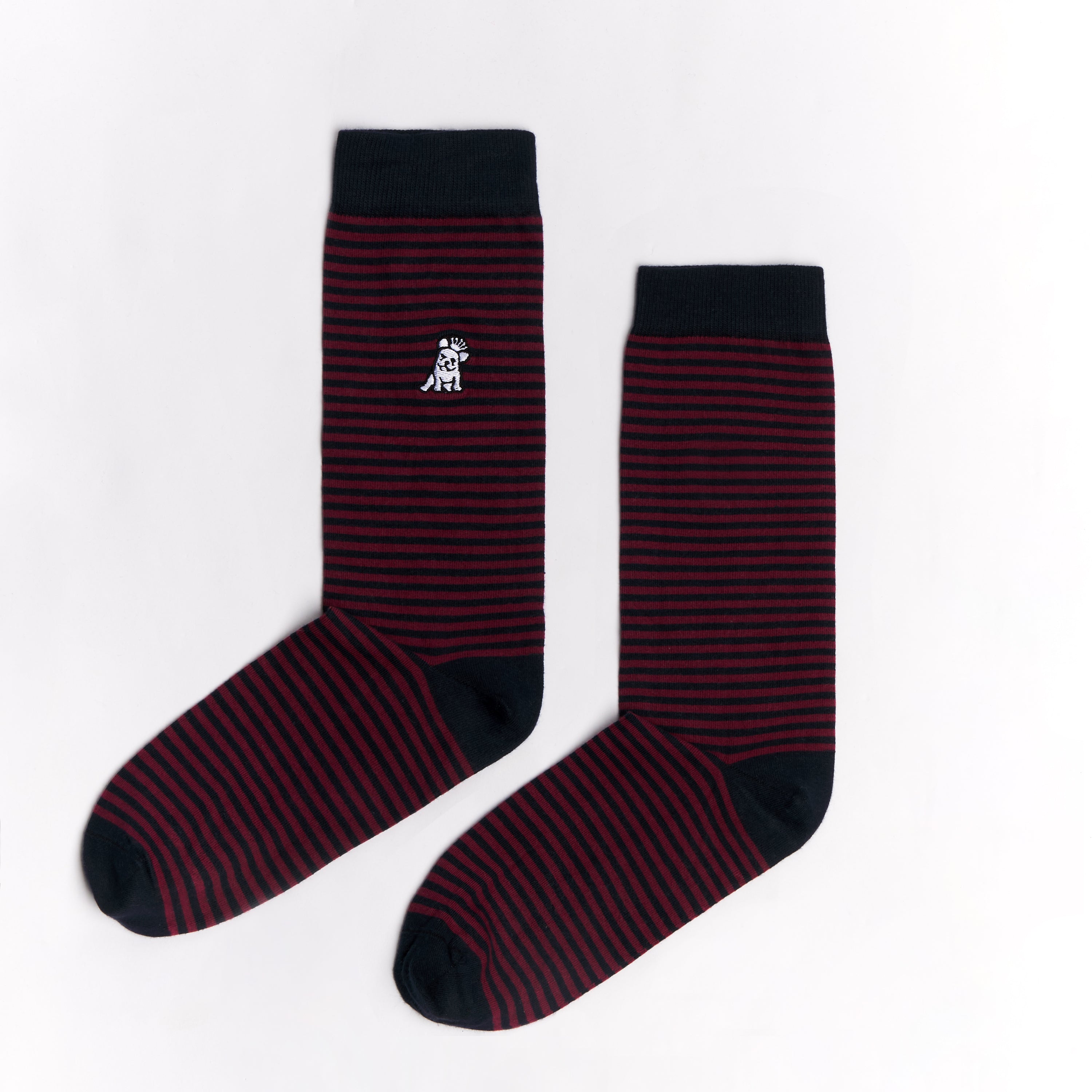 A pair of dark red and navy blue striped mid-calf socks with a solid navy cuff, heel, and toe. There is a small dog graphic near the ankle. The socks are laid flat on a white surface.