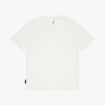 A plain white T-shirt shown from the back, featuring a small black tag on the lower left hem and a small gray graphic near the inner collar
