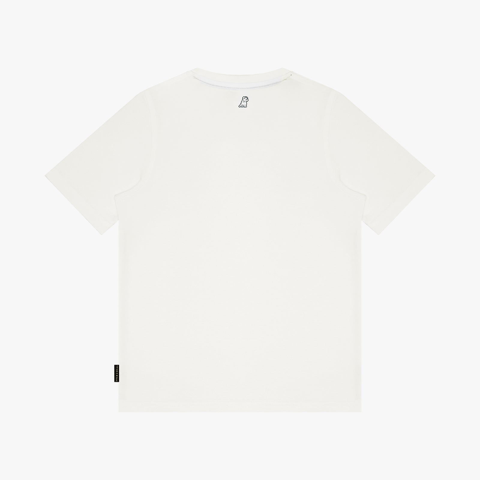 A plain white T-shirt shown from the back, featuring a small black tag on the lower left hem and a small gray graphic near the inner collar