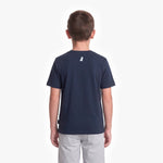 A child viewed from the back wearing a navy blue T-shirt with a small white dog logo on the upper back