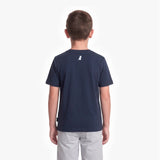 A child viewed from the back wearing a navy blue T-shirt with a small white dog logo on the upper back