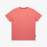 Flat-lay of the pink t-shirt: The shirt is laid flat, showcasing the full front design with the small white and black embroidered logo on the chest.