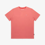 The salmon pink t-shirt laid flat, showing the front of the shirt with the small embroidered animal logo on the left chest.