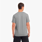 Man wearing a gray t-shirt on a white background