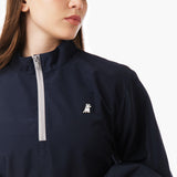 Close-up of a blue jacket featuring a zippered neck, highlighting the zipper detail and fabric texture. The jacket appears sleek and modern.