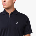 Side profile of a man wearing the navy blue polo shirt, highlighting the fit and collar details.