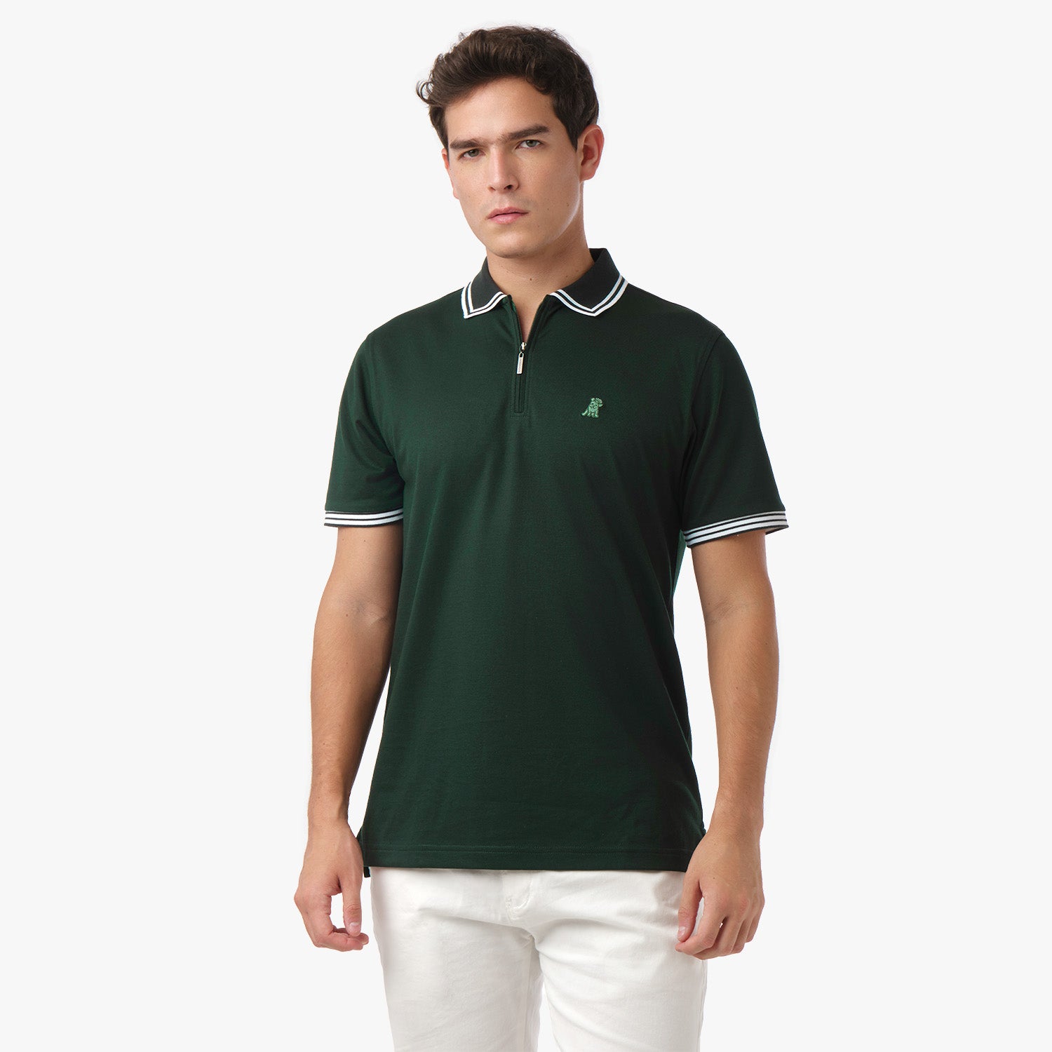 Male model wearing a dark green polo shirt with white trim, standing with a serious expression.