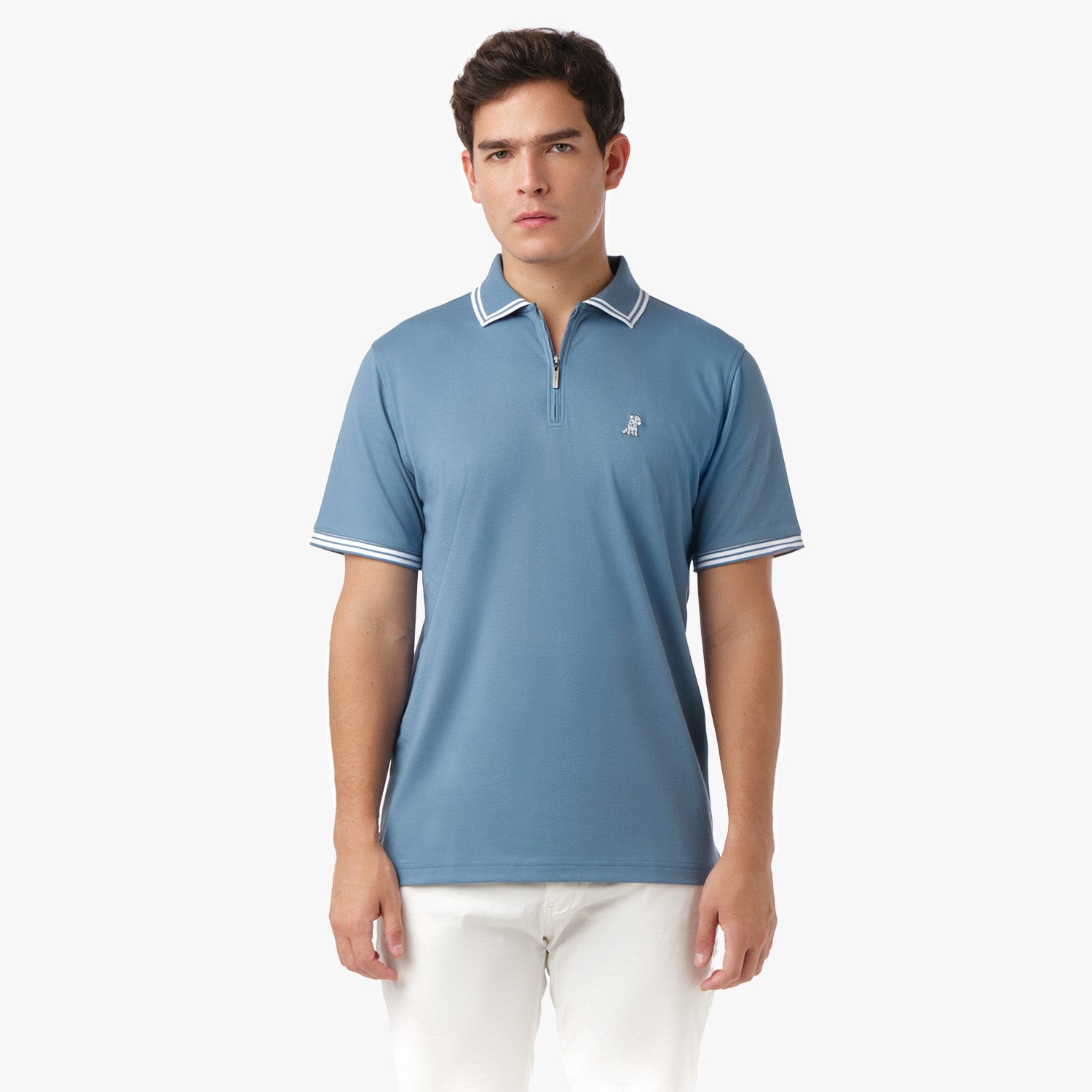 Male model wearing a light blue polo shirt with white trim, standing with a relaxed posture.