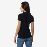 Rear view of the woman in the black polo shirt, showing the back design.