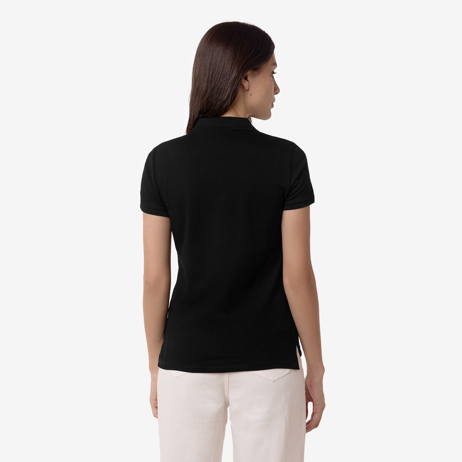 Rear view of the woman in the black polo shirt, showing the back design.