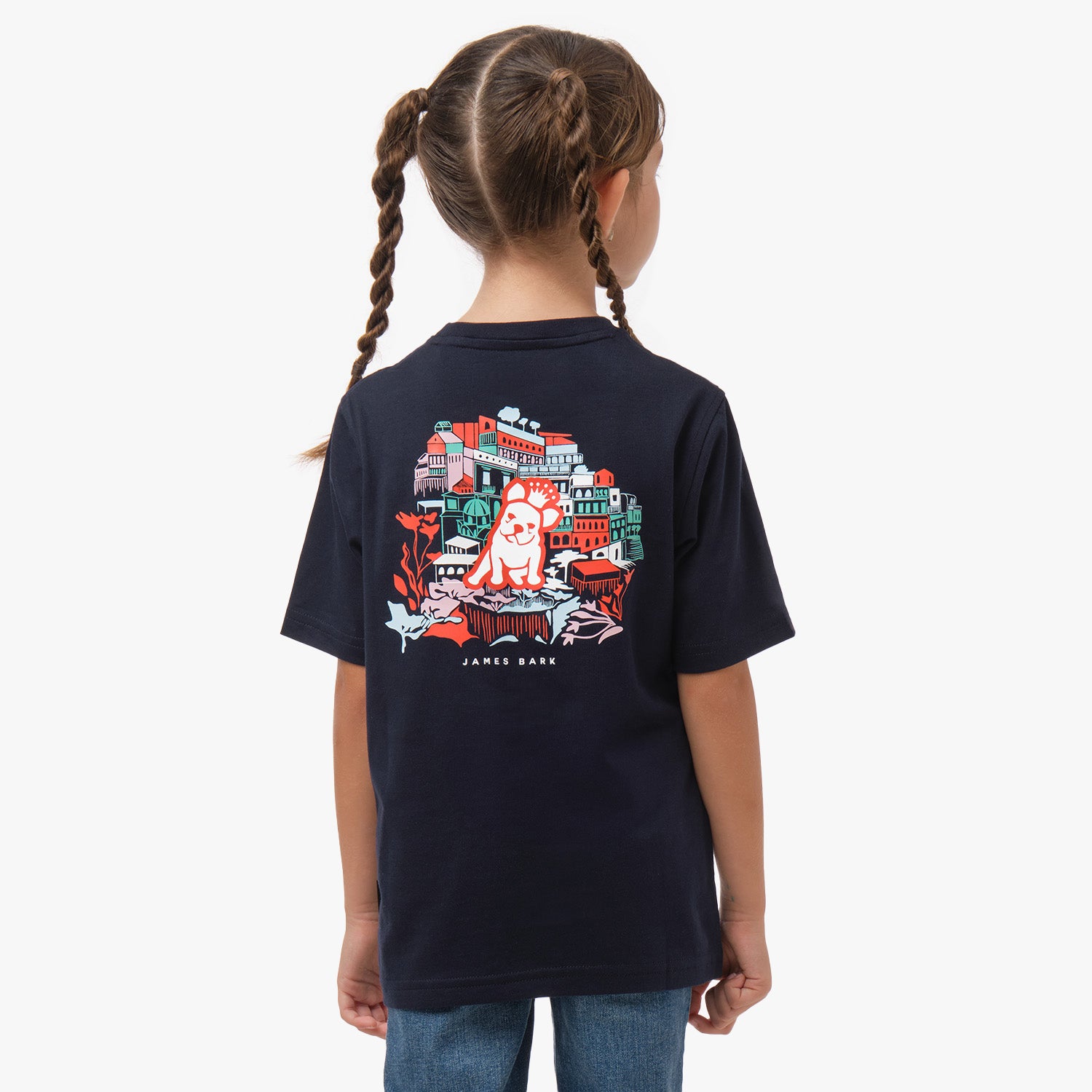 Rear view of a girl wearing a black T-shirt with a colorful graphic on the back, featuring an intricate design in red, green, and white.