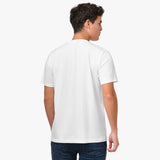 Back view of a man wearing the white t-shirt: The man is standing with his back to the camera, showing the simple back design of the t-shirt.