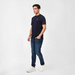 Man wearing a Men's Crew Neck Jersey T-Shirt in color Dress Blue with navy pants