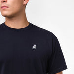 Close-up of a Men's Crew Neck Jersey T-Shirt in color Dress Blue with a white embroidered logo