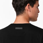 Close-up of the back of the t-shirt, focusing on the tag detail near the neckline.