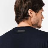 Close-up of the back of the t-shirt, focusing on the tag detail near the neckline.