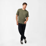 The olive green t-shirt laid flat from a different angle to emphasize the fabric and color.