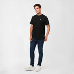 Man wearing a Men's Crew Neck Jersey T-Shirt in color Black Beauty with Dress Blue pants