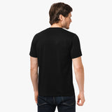 Back view of a man wearing the black t-shirt: The man is standing with his back to the camera, showing the simple back design of the t-shirt.