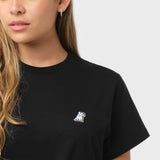 Flat-lay front view of the black t-shirt highlighting the small logo on the chest.