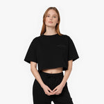 Female model wearing a black James Bark Elements cropped t-shirt.