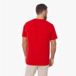Male model from behind wearing a red James Bark t-shirt and khaki pants