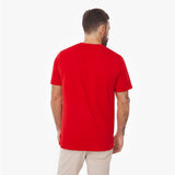 Male model from behind wearing a red James Bark t-shirt and khaki pants
