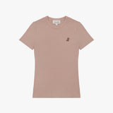 A dusty rose-colored short-sleeve T-shirt laid flat on a white background. It features a ribbed crewneck collar and a fitted silhouette. A small embroidered logo of a dog in a darker brown shade is positioned on the left chest area. The neckline includes a white label with black text displaying the brand "JAMES BARK." The fabric appears to be soft and lightweight.