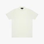White polo shirt on a light beige background