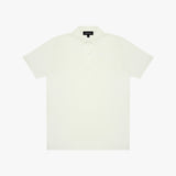 White polo shirt on a light beige background