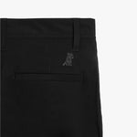 A detailed close-up of the pocket stitching and subtle embroidered logo on the black pants.