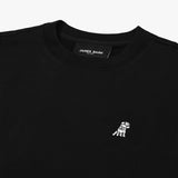 Close-up of the neckline and embroidered dog logo on the black sweatshirt, highlighting the fabric texture and detailed stitching.