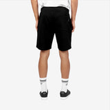 This image showcases the back view of the black athletic shorts. The shorts feature a back pocket, adding practicality and style. The design remains minimalistic, with the same clean lines and small logo, creating a versatile and stylish look for casual wear.