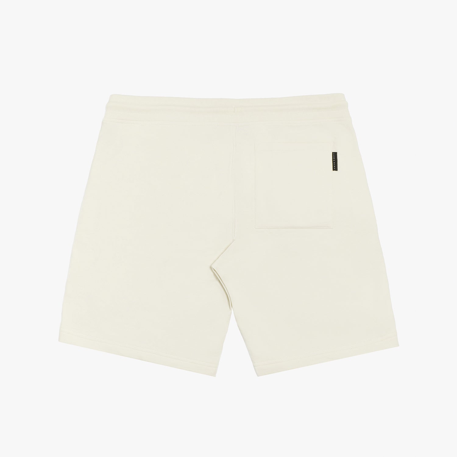 Flat-lay back view of cream-colored shorts, showcasing a clean and minimalist design.