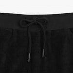 Close-up view of the waistband of black shorts, featuring a drawstring with black tips for an adjustable and secure fit