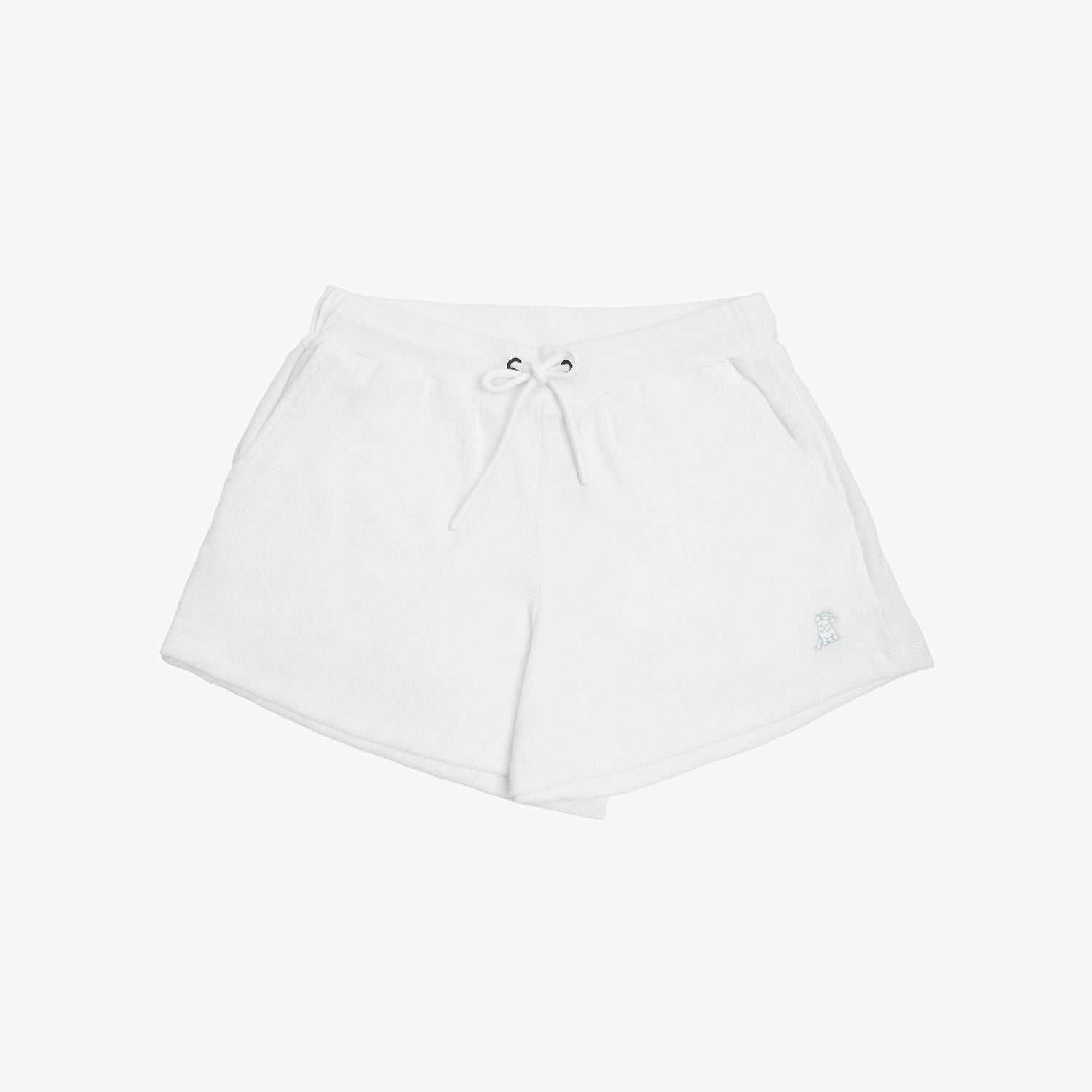 Flat-lay view of white shorts with a drawstring waistband, featuring a small embroidered dog logo near the hem, showcasing a minimalistic and casual design