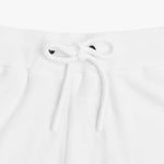 Close-up of the waistband of white shorts, featuring a drawstring with white tips for an adjustable fit and a clean design