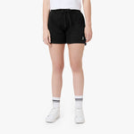 This image features the model wearing black athletic shorts, paired with white sneakers and striped socks. The shorts, like in the previous images, have the small logo on the lower left side. The model is also wearing a white t-shirt. The look is simple yet stylish, maintaining a casual vibe. 